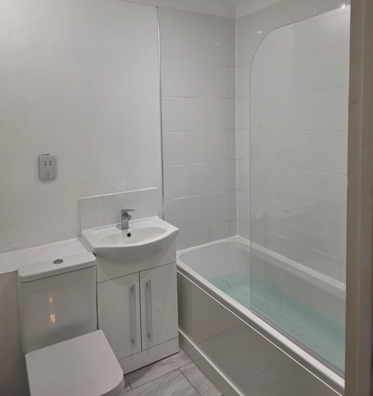 Bathroom with a bath and shower enclosure