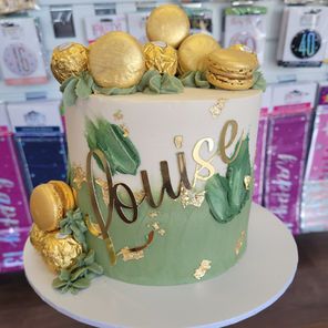 Elegant macaron topped buttercream cake