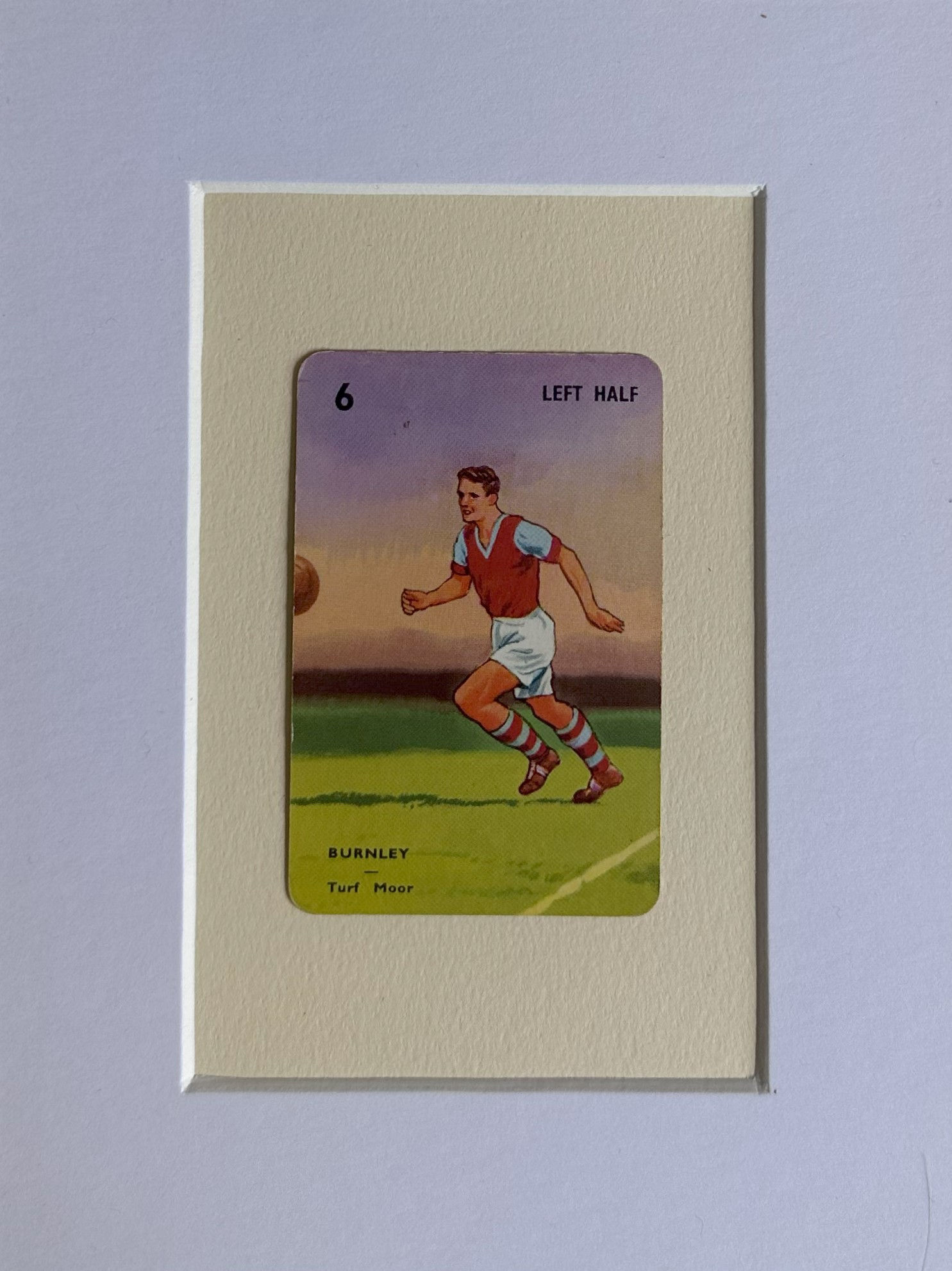 Left Half from Burnley playing on a grass pitch