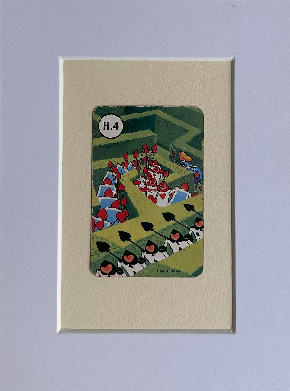 Alice being chased by the Card Soldiers through a maze