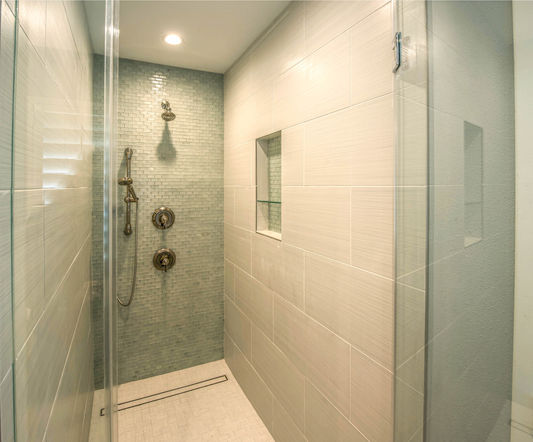 Large format bamboo finish wall tile, porcelain tile mosaic floor, linear drain, beach glass mosaic wall tile, LED lighting, brushed nickel plumbing, hand shower, shower niche, modern shower, small space design, www.karriekingphotography.com  