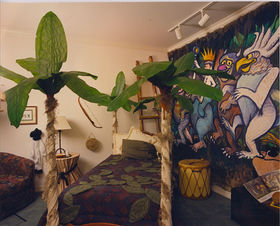 Where The Wild Things Are, wall mural, painted mural, tree four poster bed, leather drum accessory, ladder, leaf bed coverlet, fantasy interior design. 
