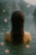 women in hot springs with cherry blossoms relaxing head spa.