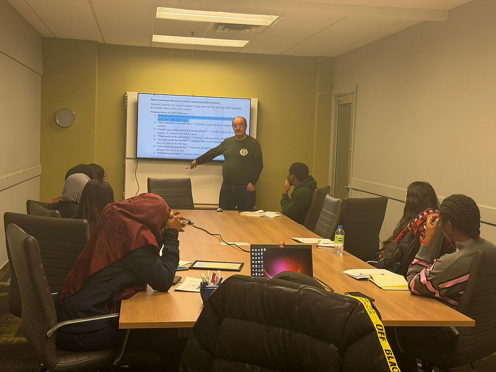 High angle view of a group workshop with newcomers learning job skills