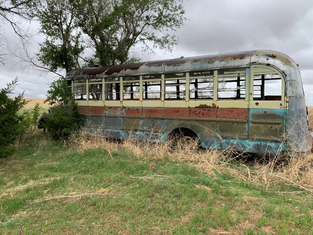 an old bus on a farm