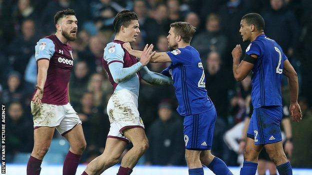 Jamie Ward in a tangle with Jack Grealish as Cardiff City faced Aston Villa