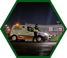 Vulture CCTV SWL Security van and response driver securing construction site at night time plant equipment behind perimeter protection metal gates. Green hexagon border.