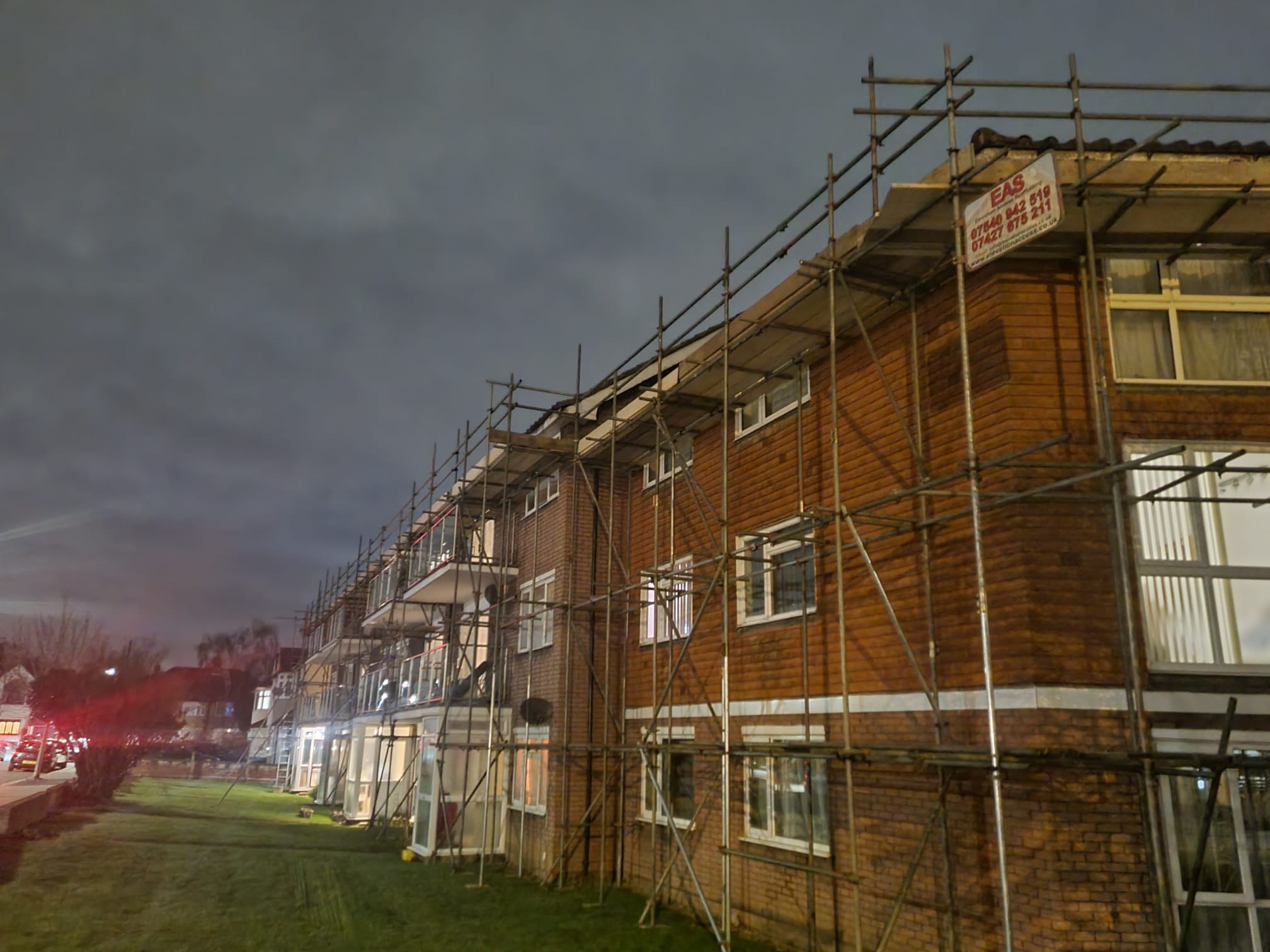 Roof-level scaffolding access on a brick property