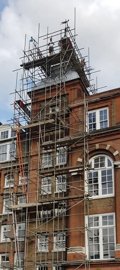 Residential scaffolding with safety netting and edge protection