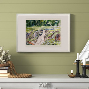Watercolor and In landscape painting of a waterfall on a wall in a room with books and candles.