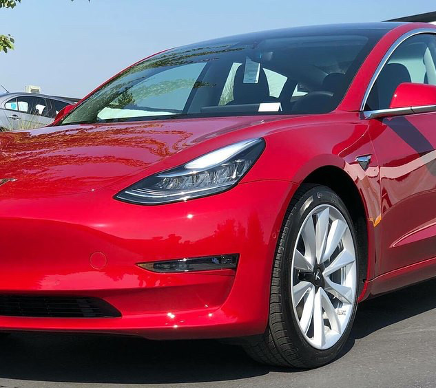 Red Tesla Model 3 with Ceramic Pro