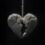 A cracked stone heart suspended by a string against a dark background, symbolizing fragility and brokenness.