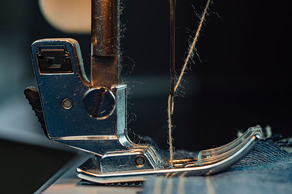vecteezy_close-up-a-sewing-machine-sews-denim_2931415.JPG