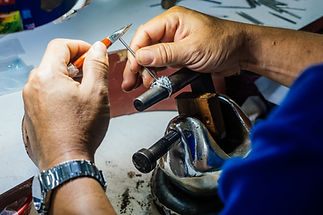 vecteezy_close-up-of-a-goldsmith-hand-making-silver-ring_2463439.jpg