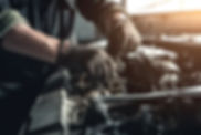 vecteezy_auto-mechanic-working-on-car-broken-engine-in-mechanics_23979713.jpg