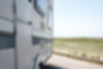 vecteezy_mobile-home-stands-on-the-seashore-near-the-road_18936928.jpg
