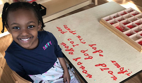 Child working with cursive letters
