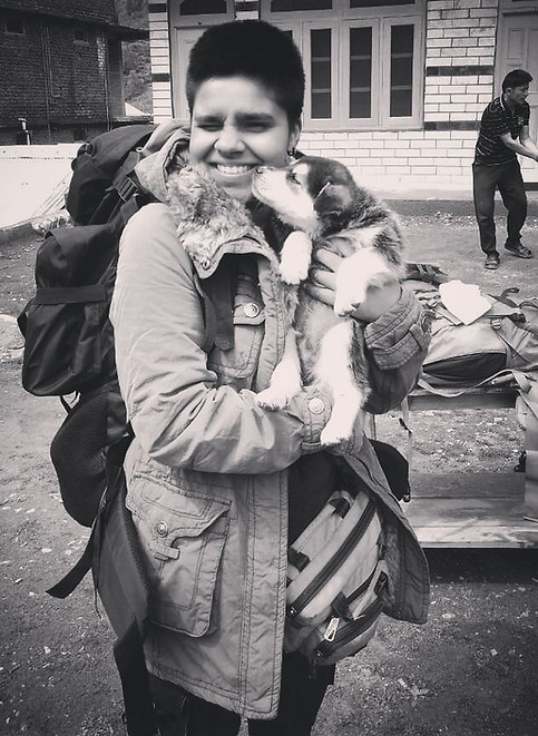 Sushmita Roy at work and at ease—captured in soft, natural light alongside a playful puppy. A queer, non‑binary tattoo artist and product designer based in K’jipuktuk (Halifax), Nova Scotia, Sushmita brings authenticity, warmth, and creativity to every piece. This candid moment speaks to their approachable energy and deep respect for the unceded Mi’kmaq lands they call home.
