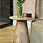 Thumbnail: Zijaanzicht van de Sahara Elegance Table, met een kegelvormig ontwerp en leren afwerking.