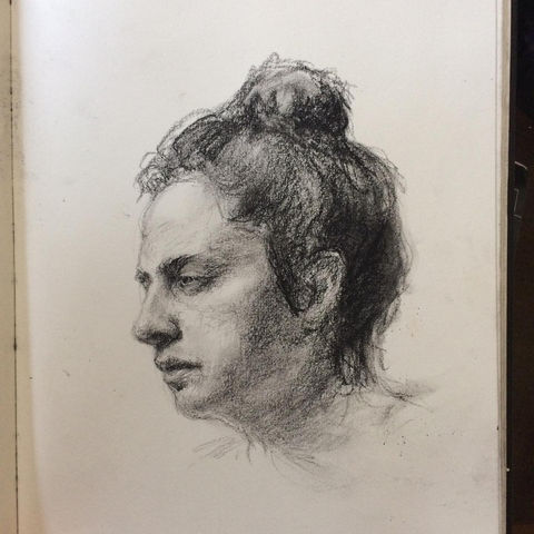 a black and white drawing of a woman 's head with a bun