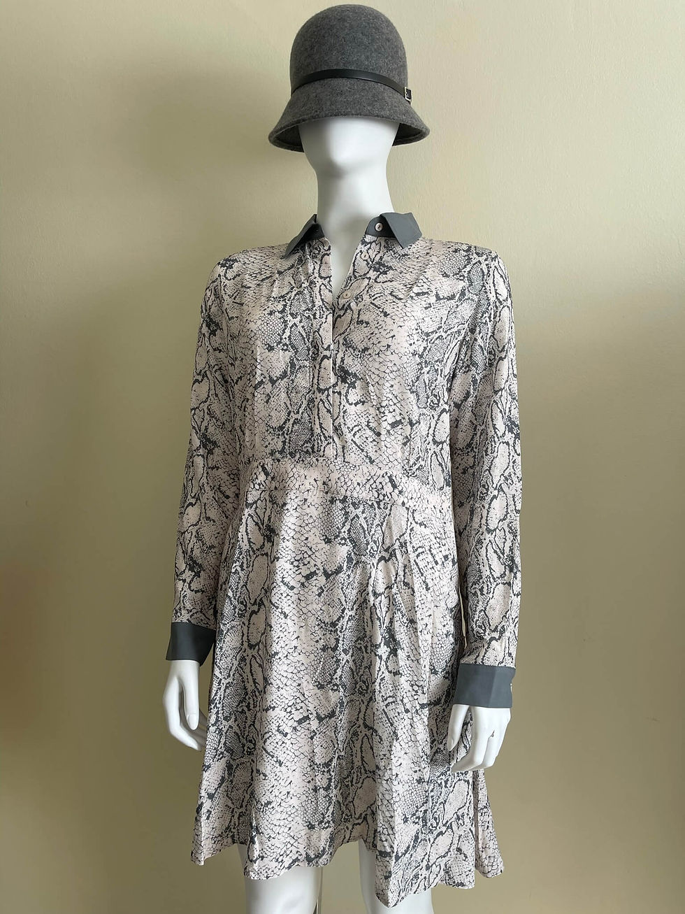 Full front mannequin view of Karen Millen shirt dress showing grey contrast cuffs and all-over snake print.