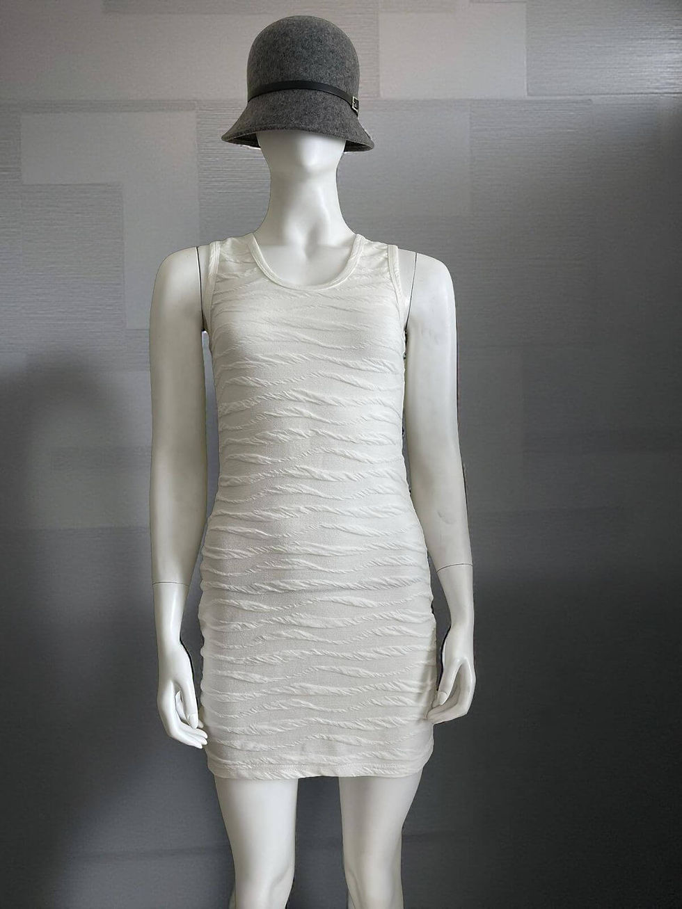 Front view of Olive De Olive Bodycon Mini Dress in white with Wavy Texture, sleeveless cut and sculpted fit.