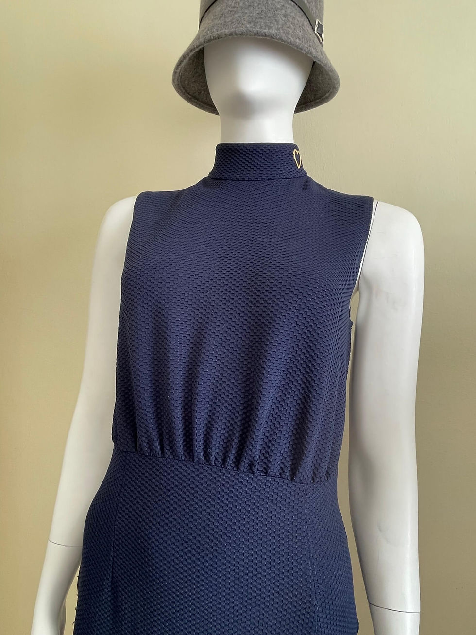 Love Moschino Sleeveless Dress in Navy – close-up of textured fabric and waist shaping.