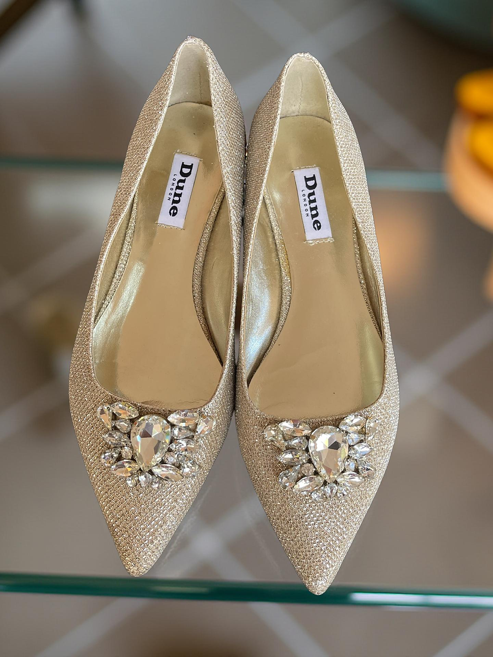 Dune Glitter Embellished Flats – side-by-side front view showing gold textured fabric & inner soles with Dune London logo