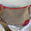 Thumbnail: Prada Canapa Logo Shoulder Bag – angled view on dust bag with beige canvas body, red leather trim & embroidered Prada logo