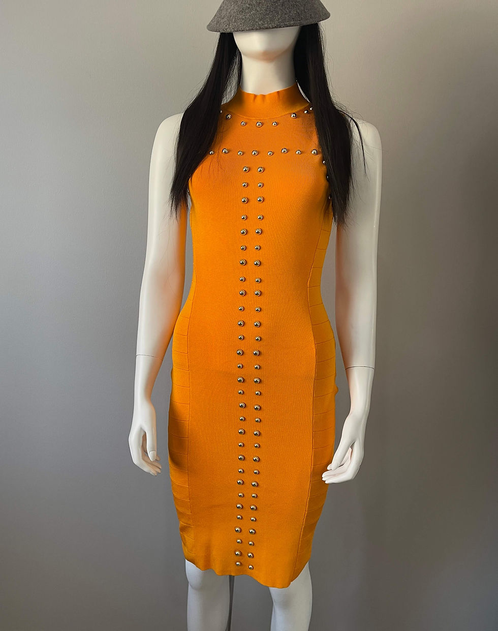 Full body front view Karen Millen Stud Bandage Dress with high neckline and central silver stud detailing.