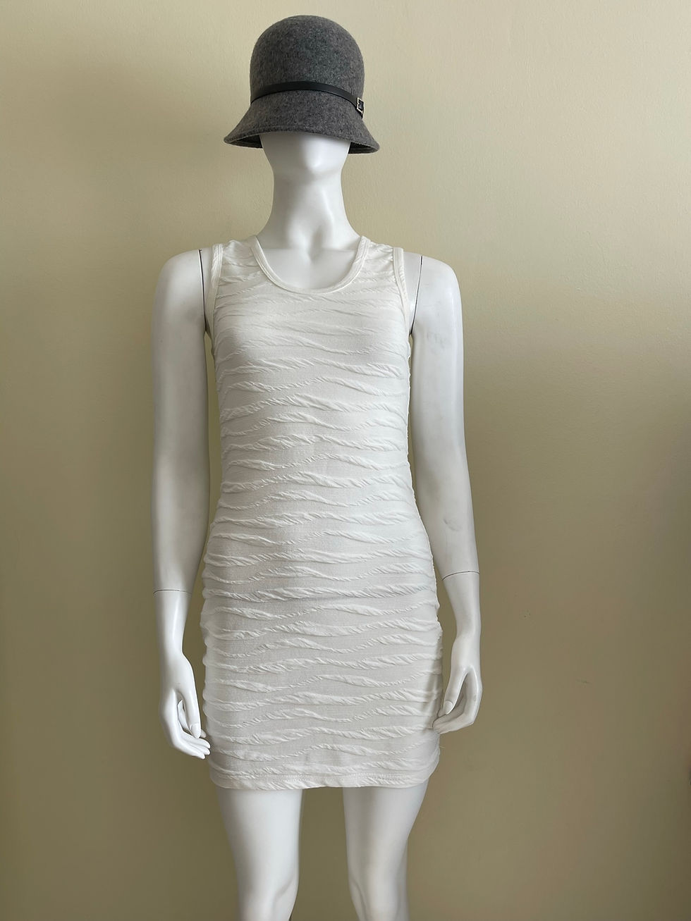 Front view of ladies Wavy Textured Bodycon Mini Dress with sleeveless cut and sculpted fit.