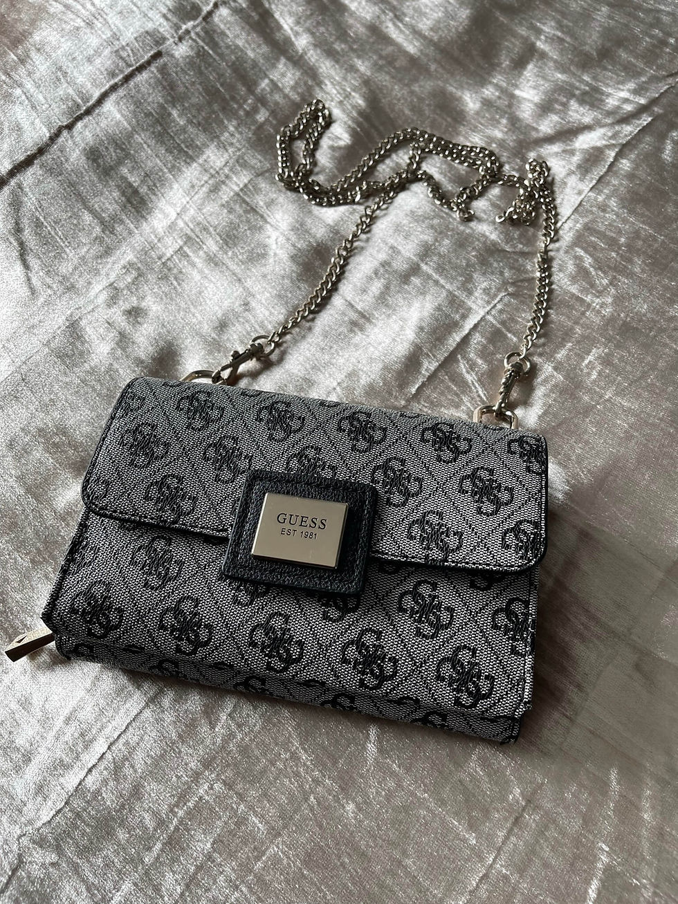 Guess Convertible Belt & Crossbody Bag on gold background, logo pattern, square flap, metal plaque, silver chain strap