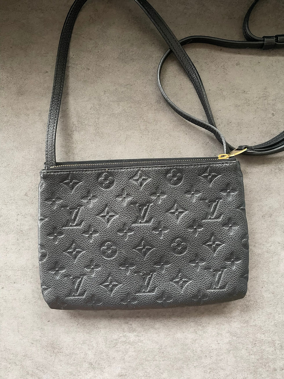 Louis Vuitton Black Monogram Empreinte Crossbody back view with full embossed Monogram leather & adjustable shoulder strap