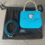 Thumbnail: Versace La Medusa Mini Bag – turquoise leather bag displayed with detachable strap and branded Versace dust bag