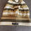 Thumbnail: Flat front lay - Dolce & Gabbana wool beanie with ribbed cuff and beige, brown, and white horizontal stripes