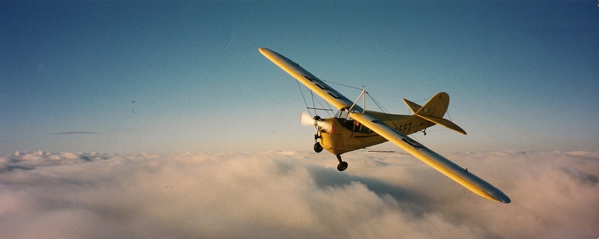 G-AEFT above cloud
