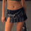 ภาพขนาดย่อ: Woman in black leather skirt, belt, and handbag close-up LUV RUSH.