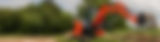 Orange mini excavator digging