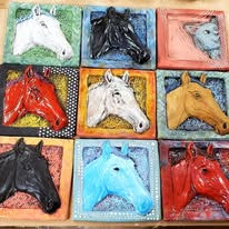 Nine colorful horse head sculptures