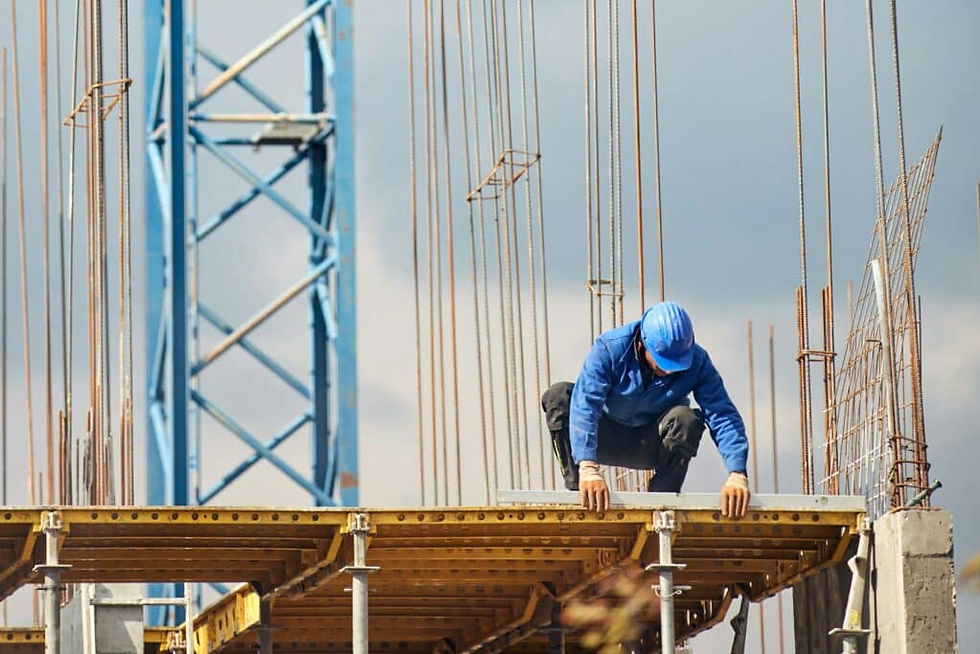 Worker in blue safety gear at a construction site