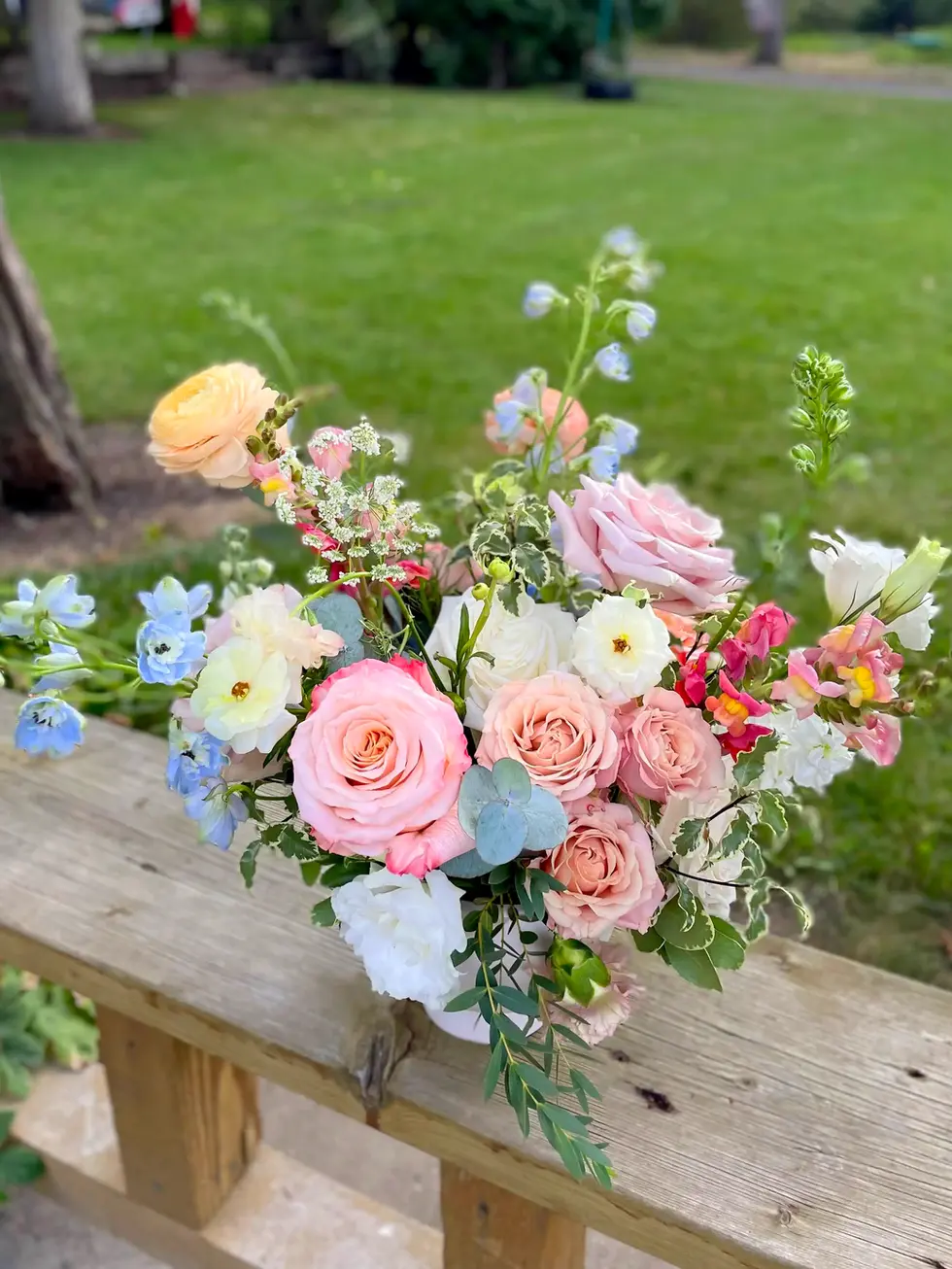 Pastel roses and wildflowers arrangement