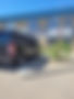 Black Jacked Custom van parked outside