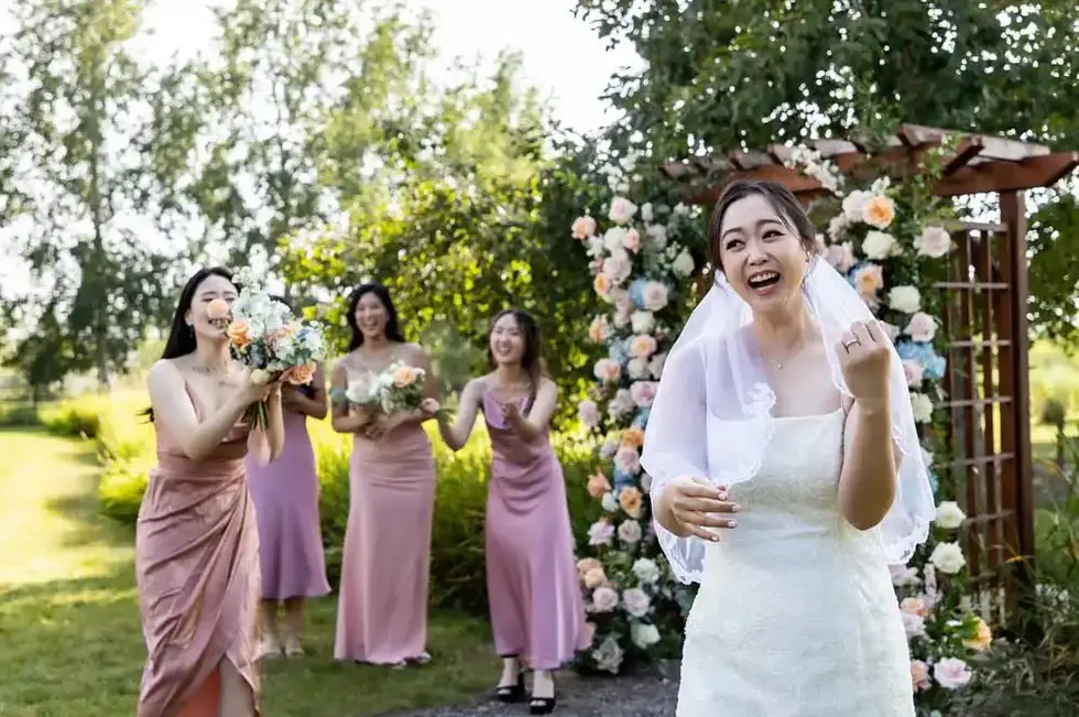 Joyful bride with bridesmaids, flower toss, wedding day