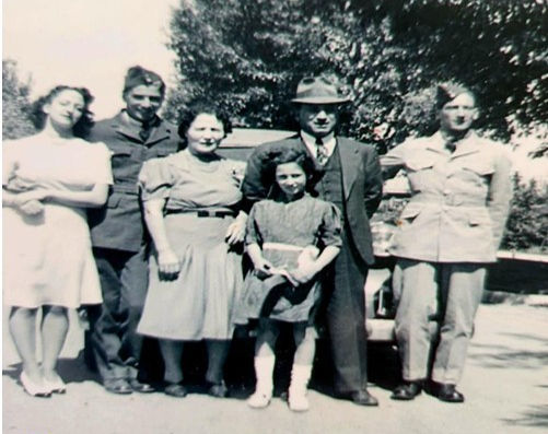 Vintage group photo with two soldiers