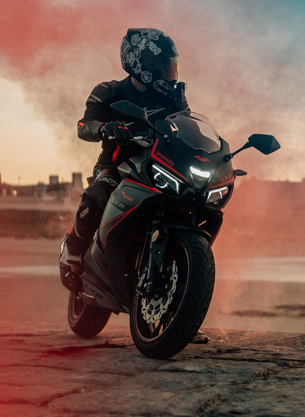 The man sitting on a bike whilst smoke bomb surrounds him_edited.jpg