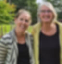 Two women smiling outdoors at 3 Pines