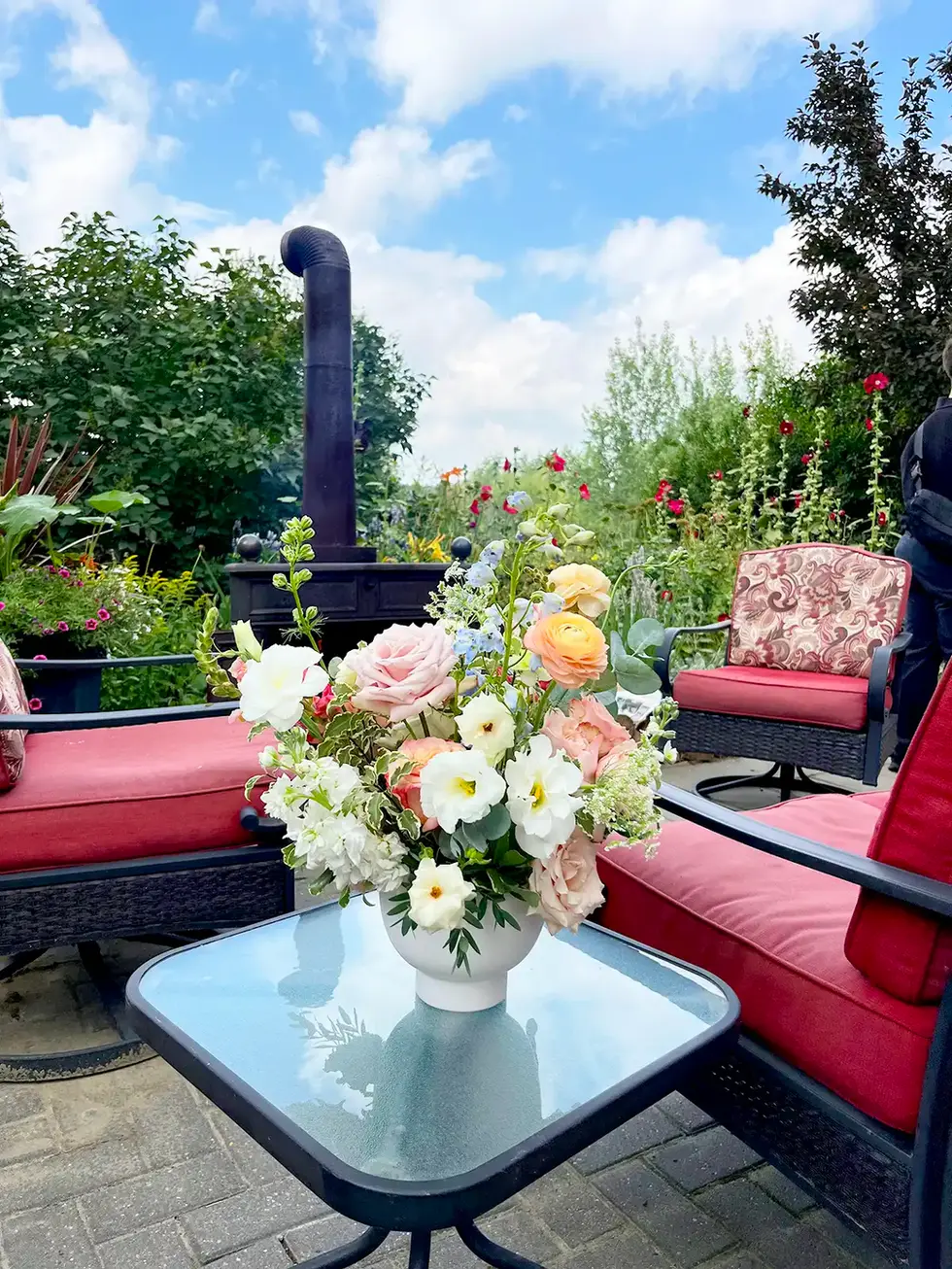 Beautiful floral arrangement on patio table