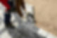 hands-worker-installing-concrete-blocks-paving-slabs-with-rubber-hammer.jpg