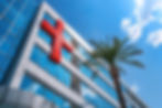 new-modern-private-hospital-building-outside-with-red-cross.jpg