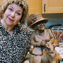 Sculptor with her latest bronze sculpture
